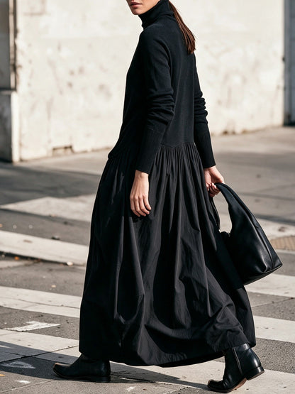 Abito lungo oversize nero con collo alto e tasche decorative