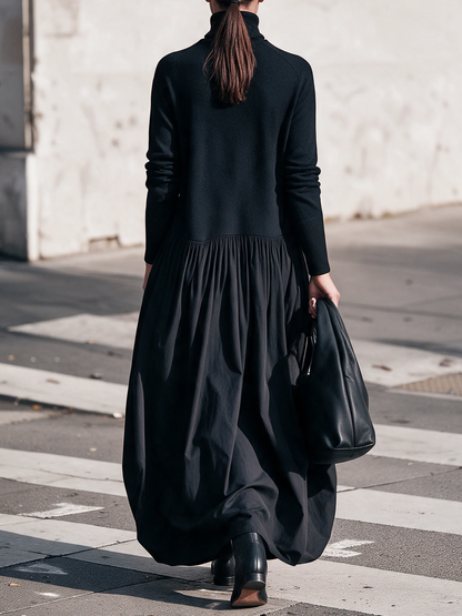 Abito lungo oversize nero con collo alto e tasche decorative