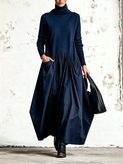 Abito lungo oversize nero con collo alto e tasche decorative