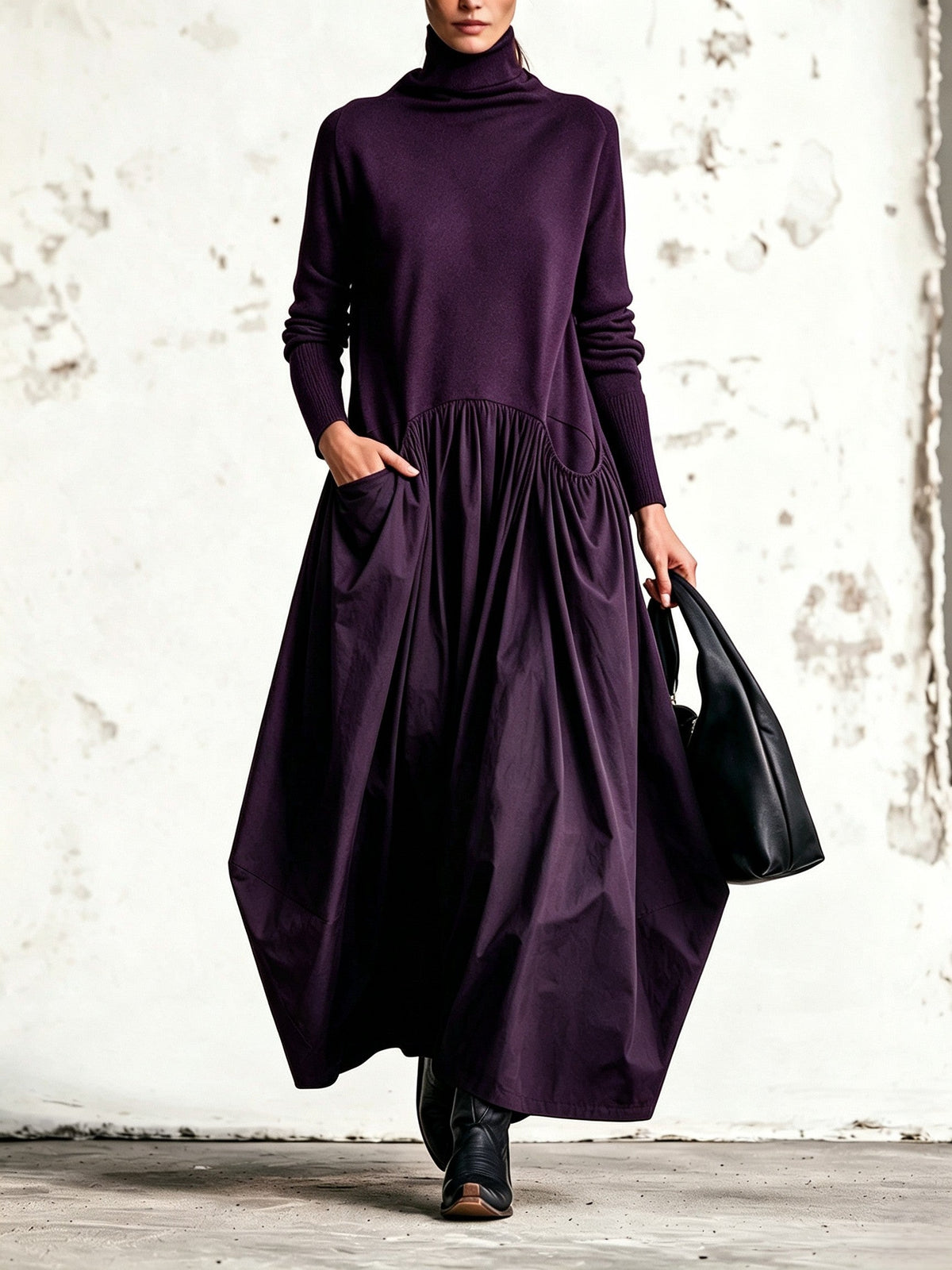 Abito lungo oversize nero con collo alto e tasche decorative