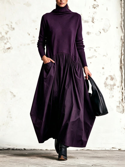 Abito lungo oversize nero con collo alto e tasche decorative