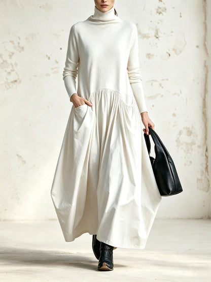 Abito lungo oversize nero con collo alto e tasche decorative
