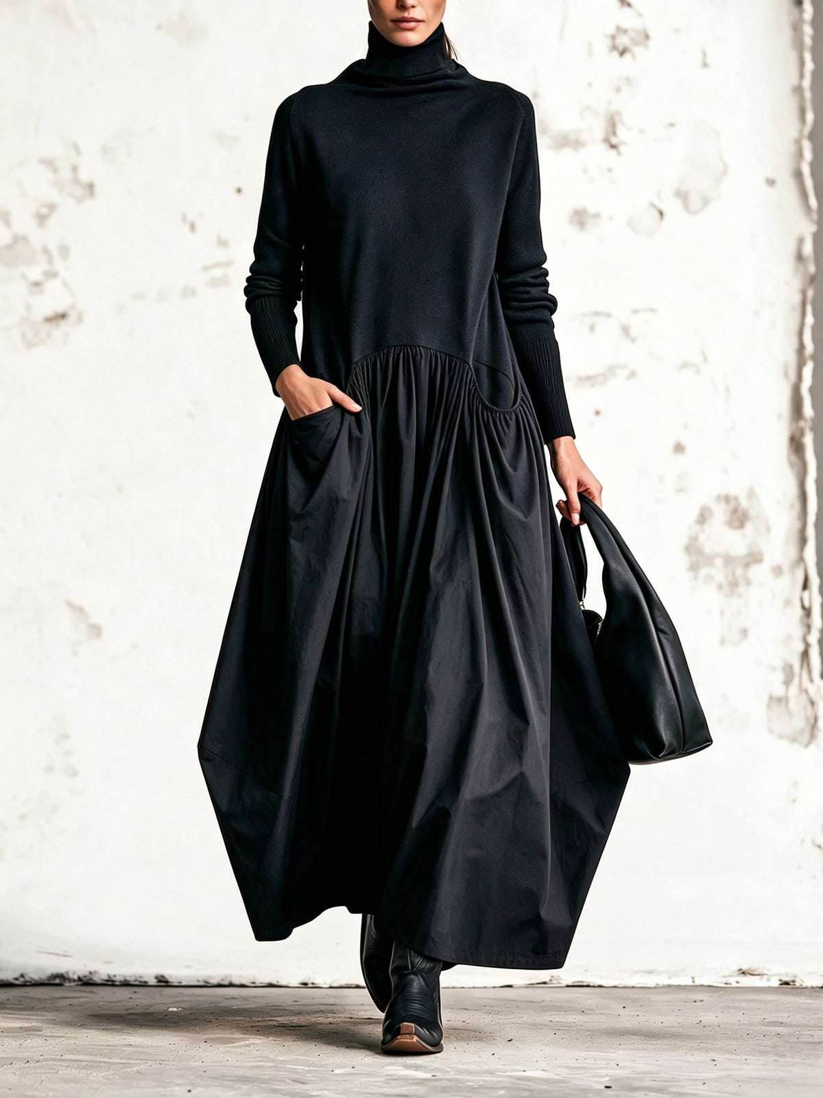 Abito lungo oversize nero con collo alto e tasche decorative