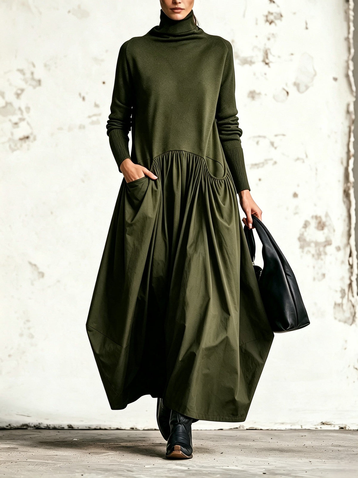 Abito lungo oversize nero con collo alto e tasche decorative